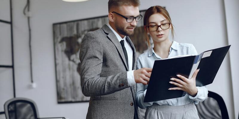 businessman-with-documents-colleagues-work-together Консультации по СНТ в Алматы